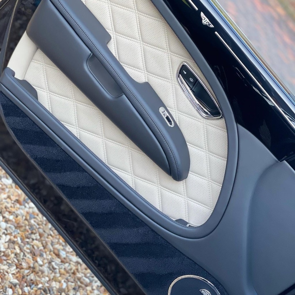 Ferrari rear grille detail — studio shot showing flawless paint