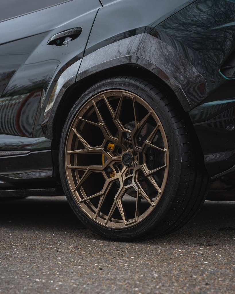 Bentley Continental GT side — gloss black with custom wheels