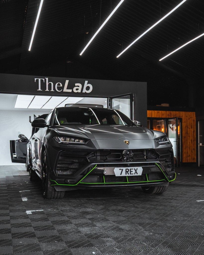 Bentley Continental GT rear quarter — dark green in studio