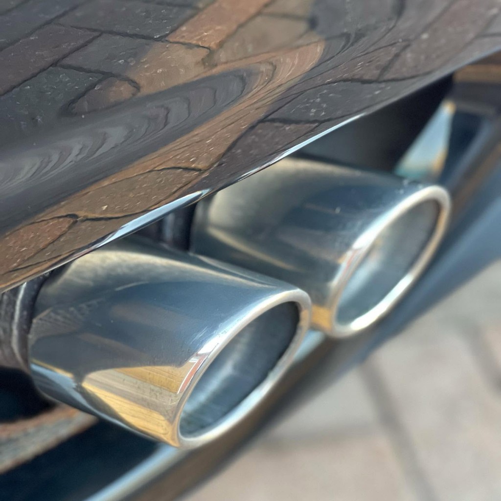 Ferrari 360 exhaust tips after — mirror-polished finish