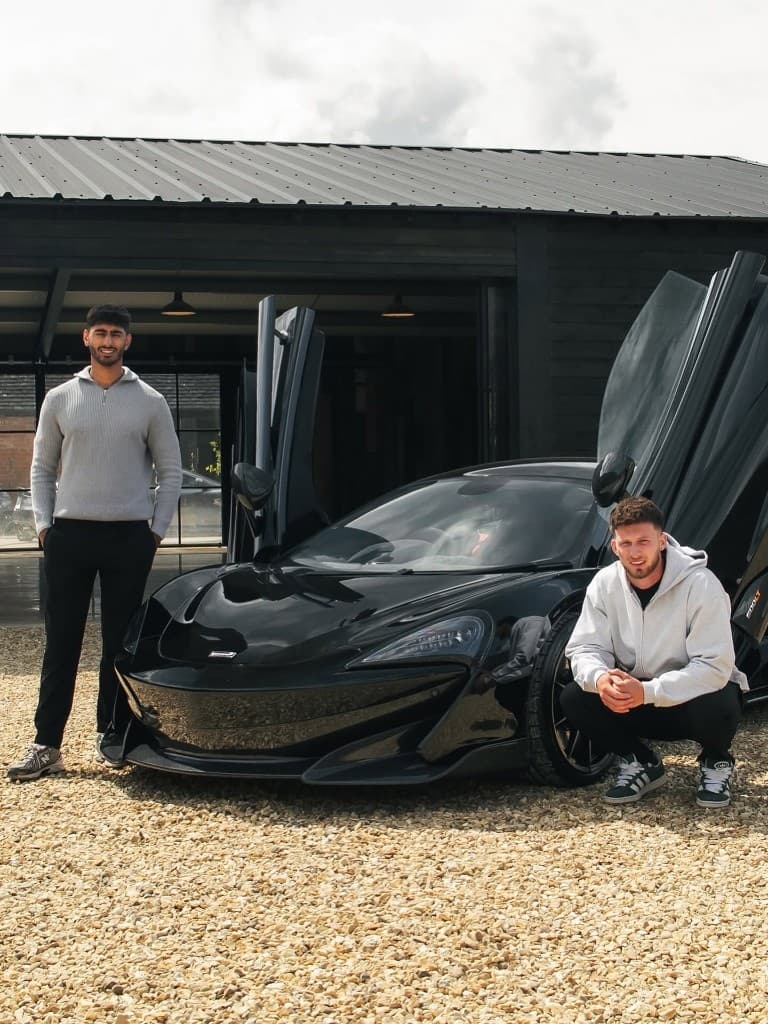 JnJ Detailing founders Joe Gora and Jacob Saul with a McLaren 600LT outside the studio