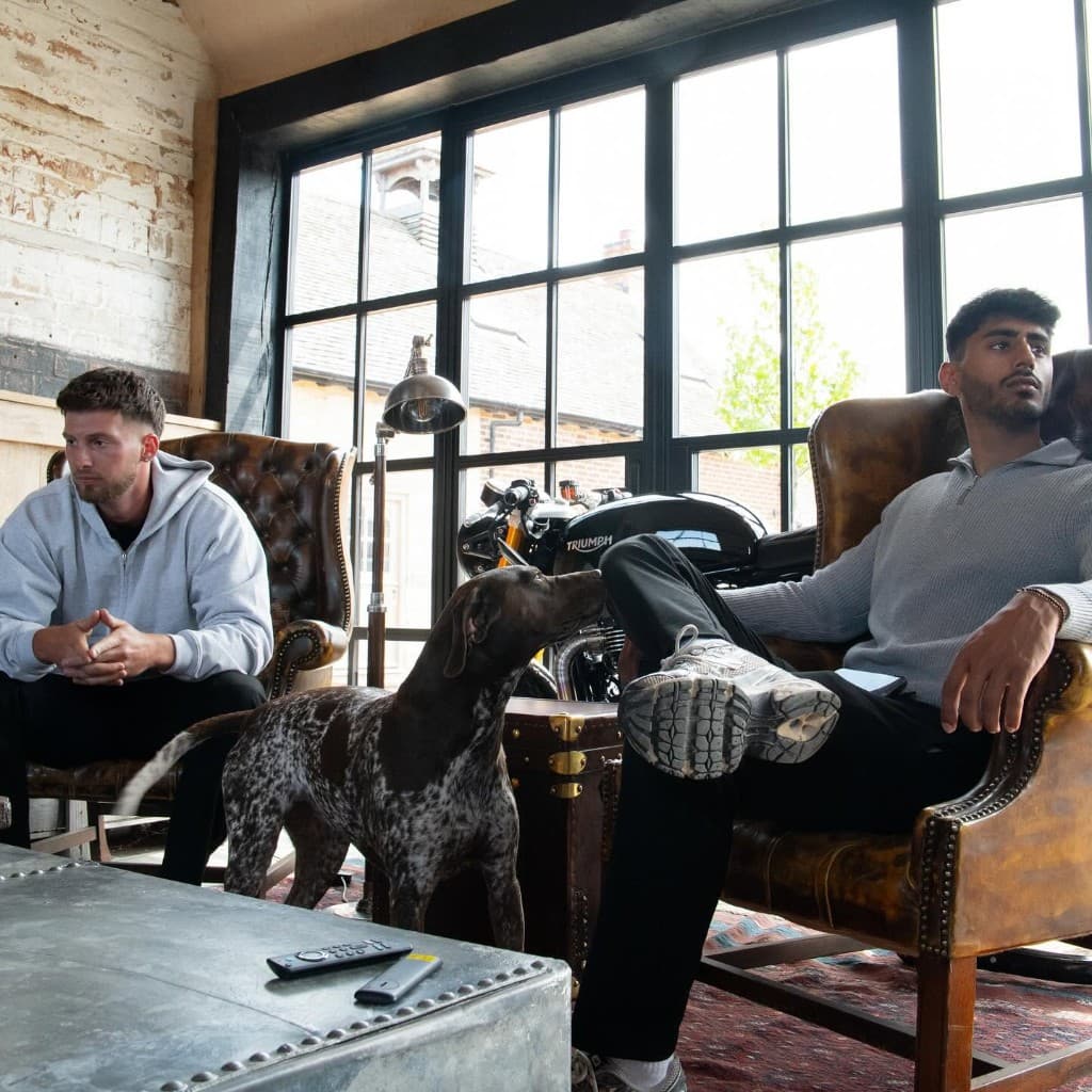 JnJ founders Joe and Jacob relaxing in the studio lounge with their dog
