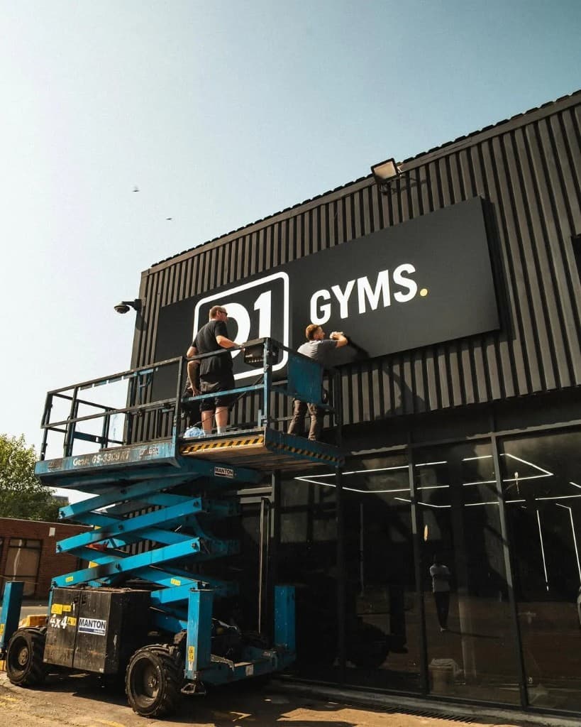 D1 Gyms exterior signage installation — large-format shop front branding by JnJ Detailing