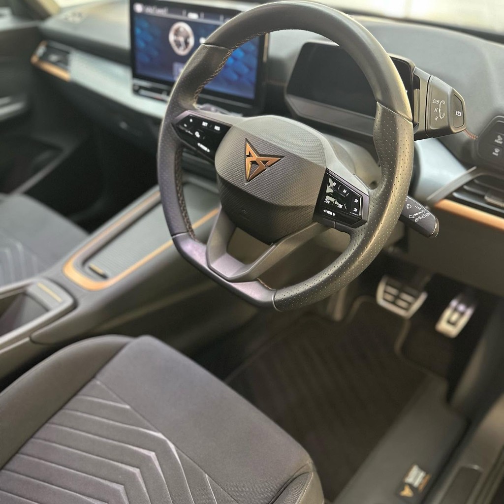 Cupra Born driver footwell after — cloth and carpet deep cleaned to like-new